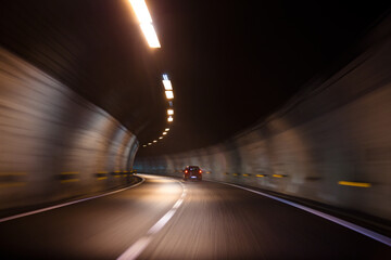 Canvas Print - Fast moving car driving in a tunnel with lights and with very good quality of road inside it