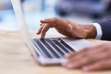 Wall Mural - prompt responses make for great email etiquette. closeup shot of a businessman working on a laptop i