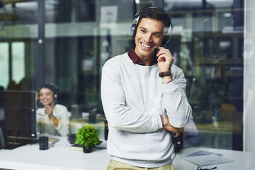 Leinwandbilder - Call us for excellent service thatll far surpass your expectations. Shot of a young call centre agent working late in an office.