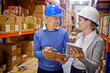 © Yuri Arcurs/peopleimages.com - Orders sorted. Shot of two managers looking at stock in a large warehouse.