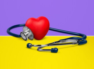 Canvas Print - The medical stethoscope lies on the national flag of Ukraine yellow-blue