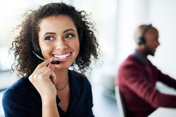 Aufkleber - That sounds like something we can help you with. Cropped shot of an attractive young female call center agent looking thoughtful while working in her office.