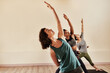 © Chanelle Malambo/peopleimages.com - Life is all about balance. Shot of a group of young men and women practicing yoga in a fitness class.