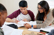 © Marius Venter/peopleimages.com - Group studies. Cropped shot of a group of university students in a study group.