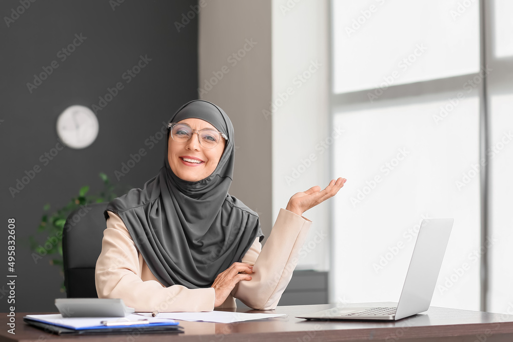 Muslim secretary working in office
