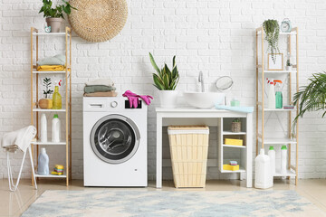 Poster - Stack of clean clothes on washing machine in laundry room