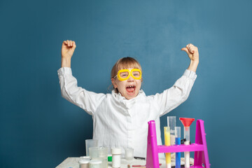 Wall Mural - Science girl power. Happy child girl and science experiment. Brainstorm, idea and science concept.