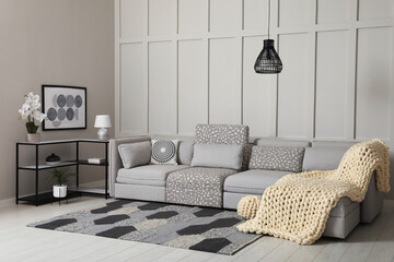 Wall Mural - Living room interior with comfortable sofa near molding wall