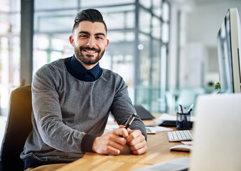 Canvas Print - Ive set some high standards for myself. Portrait of a confident young designer sitting at his desk in an office.