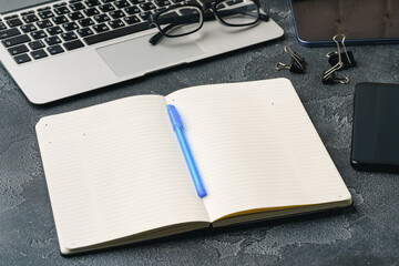 Sticker - Blank notebook with pen are on top of office desk table