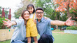 © Timeimage - Image of young Asian family playing together at park