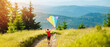 Little happy child boy running with kite. Wonderful mountain landscape in Alps at sunset. Travel, vacation alps.