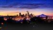 Mount Rainer seen behind modern Seattle skyline in a colourful winter dawn.
