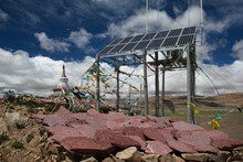 A Commercial Solar Cell Phone Tower, Mani Stones And Prayers Flags And A Small Stupa Or Buddhist Temple