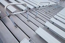 Bleachers, Looking Down The Steep Steps And Raked Seating Of A Stadium.