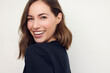 © Martin Villadsen - Portrait of beautiful natural brunette woman, smiling and looking in camera with white teeth. Close-up portrait of cute female girl in black t-shirt isolated on white background.