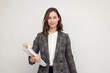 © Martin Villadsen - Beautiful and smiling business woman with paperwork in hands, standing isolated on white, looking happy about her job and looking smiling in to the camera.