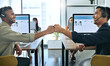 © Siphosethu Fanti/peopleimages.com - Lets do this, bro. Shot of two handsome salesmen sitting together in the office and giving each other a fist bump.