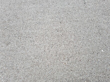 Grey concrete pavement texture close up