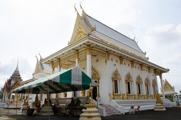 Ancient architecture antique building white ubosot church for thai people and foreign traveler travel visit and respect praying buddha blessing holy worship at Wat Tanot temple in Nonthaburi, Thailand