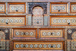 Beautiful antique inlaid wood cabinet with many drawers and compartments. Geometric arabesque patterns.