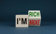 © Prazis Images - Cubes form the words I'm rich or I'm broke. The concept of effort and purpose in business