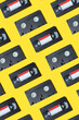 VHS video cassette, Old black videotape pattern on a yellow background, Outdated technology background.