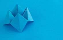 Origami Paper Fortune On Blue Background