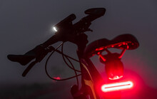 Bike With Lights Turned On In The Dark Fog.
