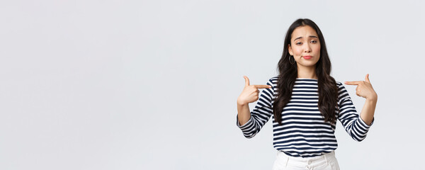 Lifestyle, beauty and fashion, people emotions concept. Confident young arrogant korean girl show-off, smirk cool and pointing herself at bragging personal achievement