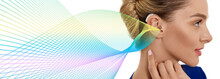 Woman With Hearing Aid Behind The Ear With Colorful Sound Waves Showing Variety Of Sounds Going To The Ear. Hearing Solutions, Concept