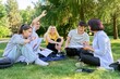 © Valerii Honcharuk - Group of high school students with female teacher, on campus lawn