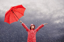 The Rain Makes Me Happy. A Beautiful Young Woman Standing Outside With Her Red Umbrella.