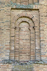 Detail of a window in the apse of the church of the Santa Maria de la Vega, a Cistercian monastery located in Renedo de la Vega (Palencia, Castilla y León, Spain) in the Mudejar style