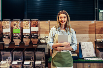 Female employee in the grocery store