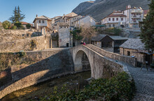 The Crooked Bridge Over The Creek In The City Of Mostar, Bosnia & Herzegovina