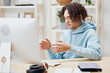© SHOTPRIME STUDIO - A young man sitting at a table in front of a computer freelance interior