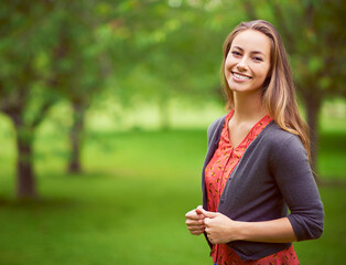 Poster - Look for the beauty in every day. Portrait of a young woman standing in the outdoors.