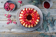 Traditional Italian budino di ricotta cheesecake pudding with chocolate crème and raspberry topping served as top view on a design plate with copy space