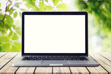 laptop on a wooden table outdoors