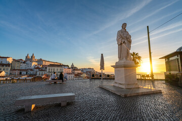 Wall Mural - Sculpture of Sao Vicente (St. Vincent of Saragossa), Lisbon's Patron Saint, with Igreja de Sao Vicente de Fora in the Background. Lisbon. Portugal