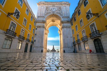 Sticker - Rua Augusta Arch at sunrise in Lisbon, Portugal. Statue of King Jose I on Commerce Square at the far end