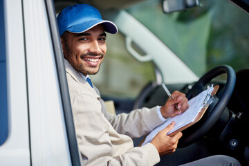 Poster - All his deliveries are running smoothly. Portrait of a happy delivery man driving his van.