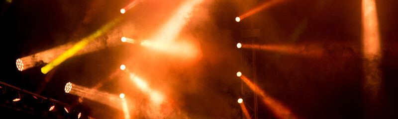 spot lights on the stage during night concert in summer