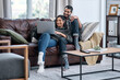 © Nicholas Felix/peopleimages.com - The outside world can wait, weve got a movie date. Shot of a young couple using a laptop while relaxing on the sofa at home.