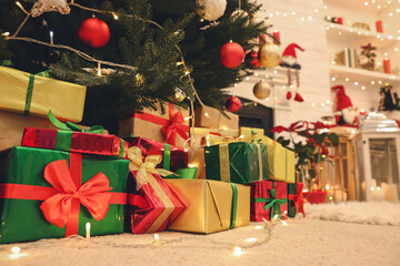 Canvas Print - Many different gift boxes on floor near Christmas tree in room