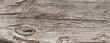  Naturalne tło niejednolitych starych grubych drewnianych desek z teksturą korozji drewna.. Kolory brązu. Tapeta.