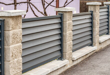 Modern Stone Fence With Aluminum  Or Metal Shutters