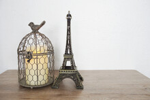 Eiffel Tower And Bird Cage Home Decoration With Space Copy Background