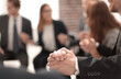 © ASDF - Business group in a circle holding hands indoors